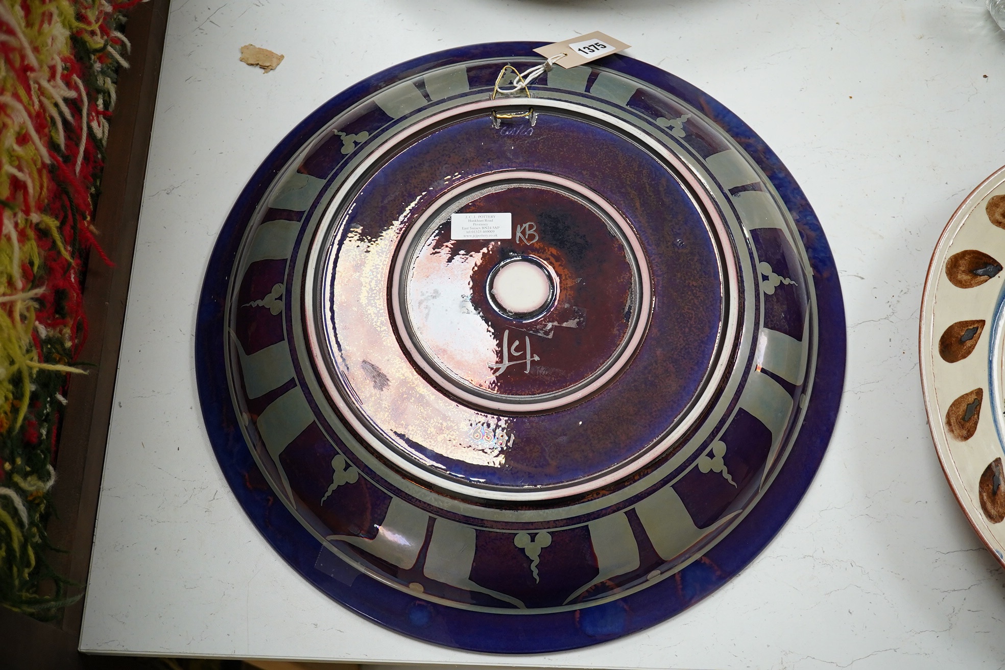 A Jonathan Chiswell Jones lustre dish, 45.5cm diameter. Condition - good